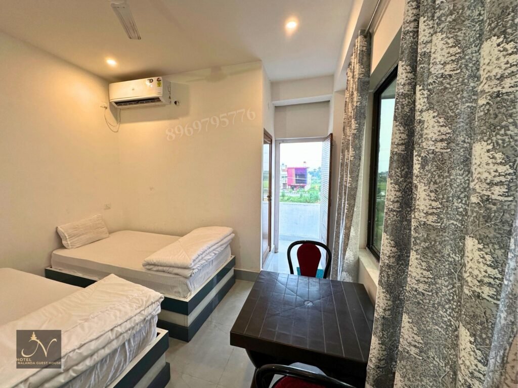 Deluxe twin bed rooms with balcony corridor Hotel Nalanda guest house rajgir
